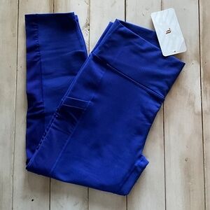 NWT. Women’s Fabletics, MILA, High-Waisted, Pocket Capri. Blue Large